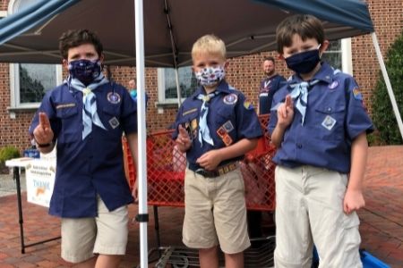 boy scouts cub pack collecting food