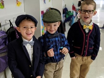 three smiling boys at school