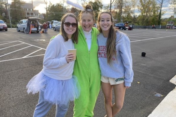 college girls dressed in Halloween costumes with leader