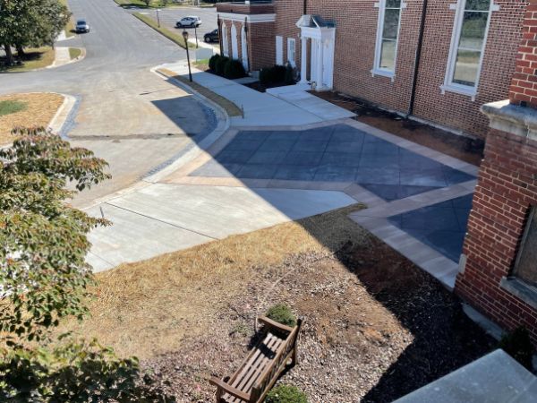 new front entrance to a church with charcoal and red colored concrete