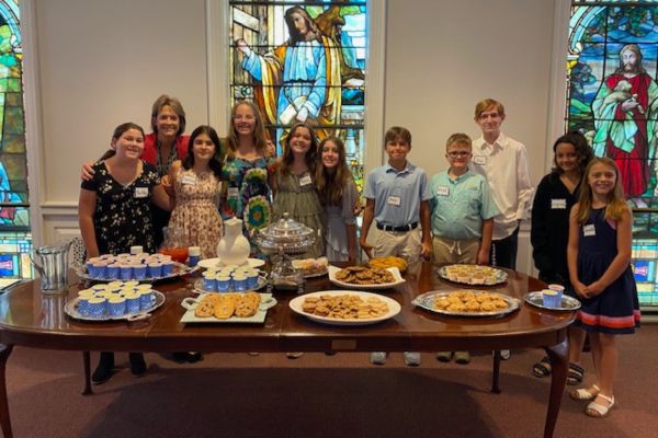 youth and adults serving Lemonade and Cookie snacks after worship at First Presbyterian Church lynchburg va